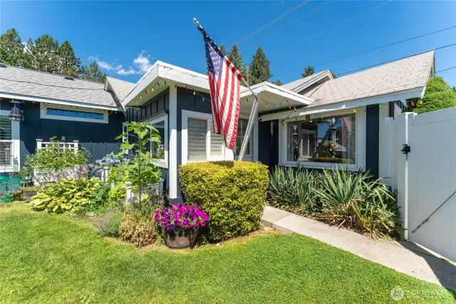 Exceptional curb appeal with a beautifully landscaped front yard that welcomes you home.