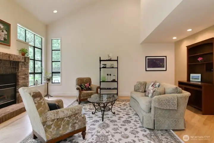 Living room is bright and cheerful with large winddows to bring the outside in!