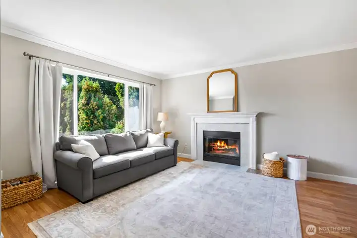 Large open living room with gas fireplace.