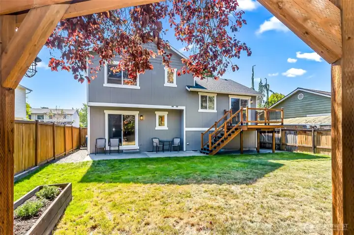 Large backyard with built in planter boxes.