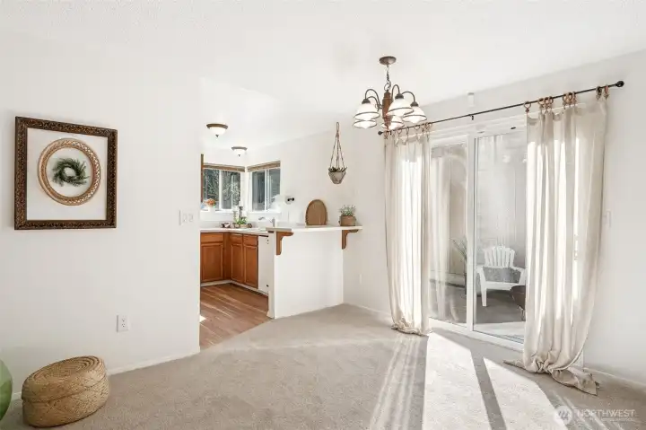 Another view of the dining room w/a slider leading to the patio.