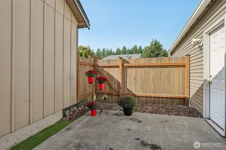 Another view of the patio area. Door on the right leads into the garage.