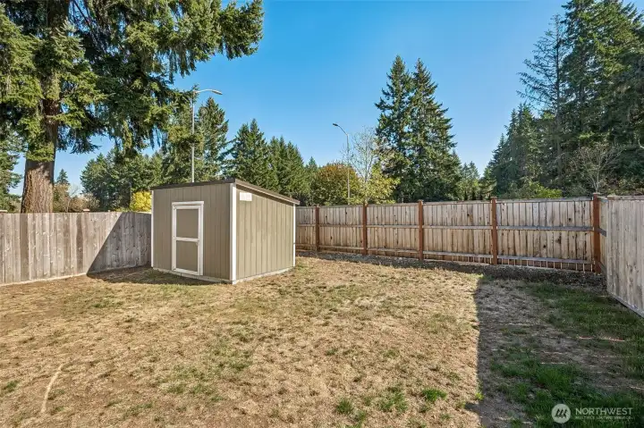 Fully fenced backyard w/a large shed. Shed does have power!