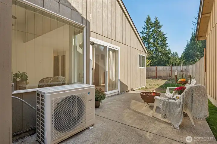Another view of the patio area. Also shown is the ductless heat pump.