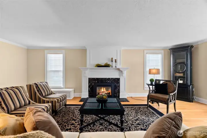 Custom designer blinds bring upscale detailing to this classic Tudor living room.