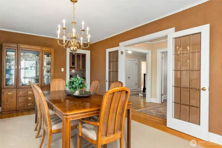 Entertain with ease - the dining room directly connects to the kitchen/wet bar area. Handcrafted French doors define the space.