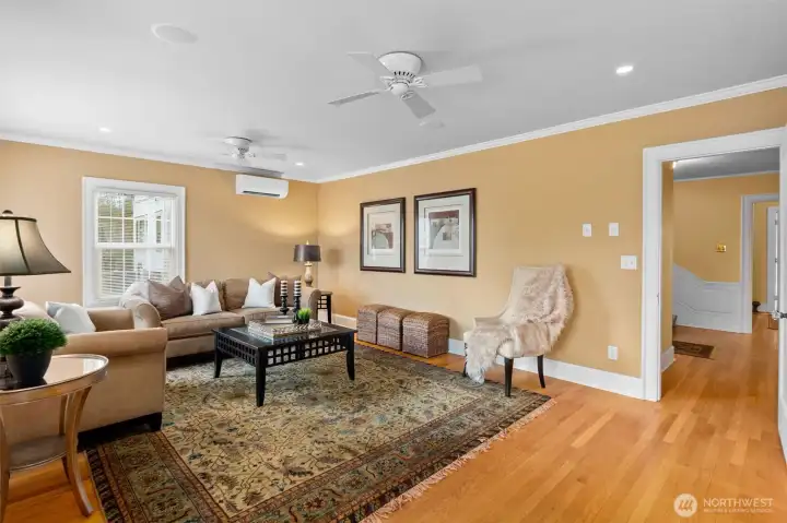 Ample natural light and timeless wood detailing make this open-concept space both beautiful and comfortable.