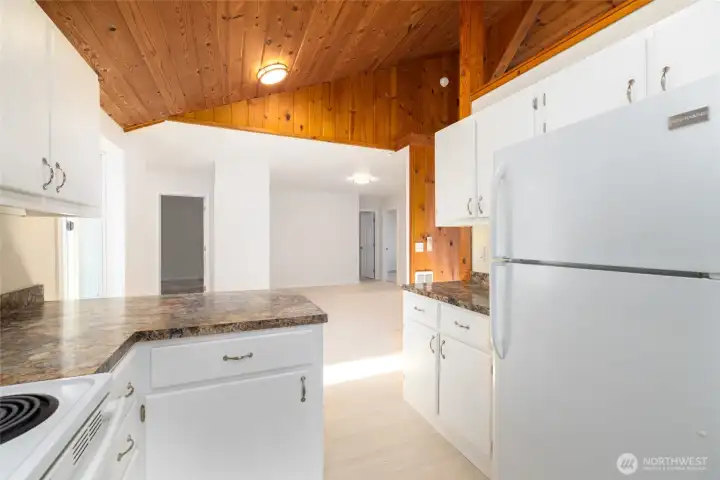 Looking from kitchen to large bonus room