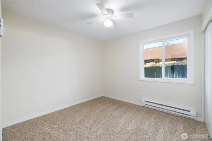 2nd bedroom off bonus room also has new carpet, paint and baseboard heat. Ceiling fan for warm nights.