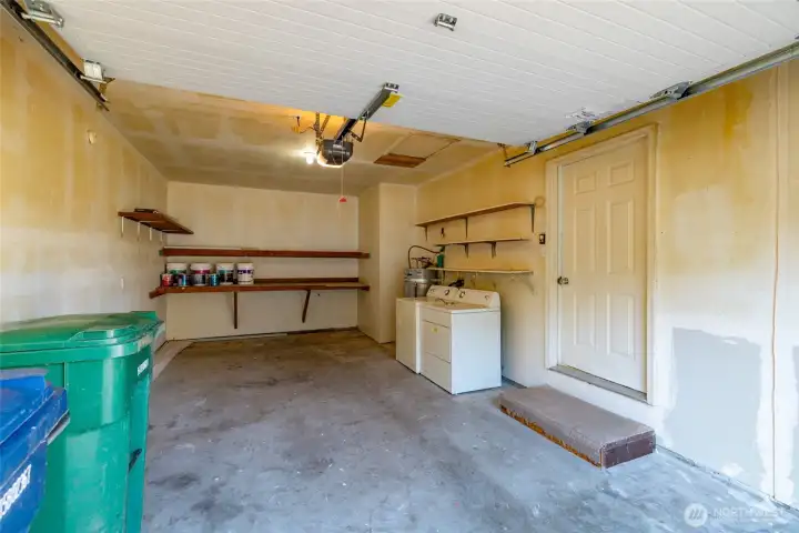 Garage has new door and is space for washer/dryer and HW