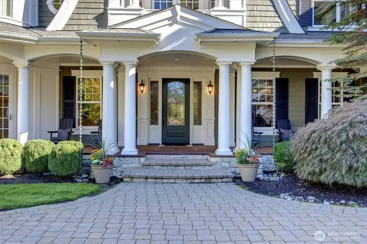 Inviting entry with wraparound front porch