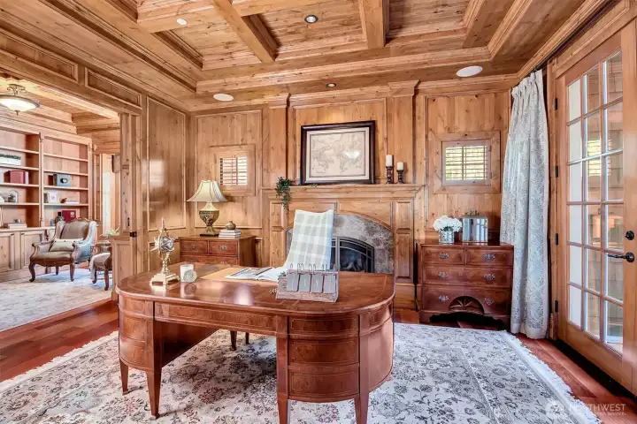 Den with gas fireplace. There is a pocket door between the library and den which could add privacy if so desired