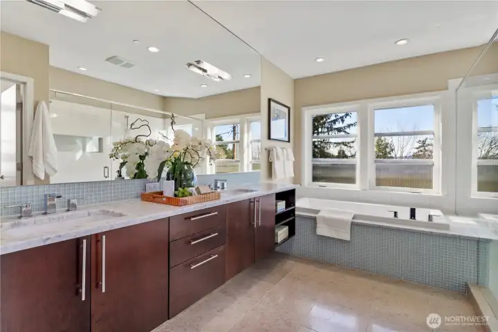 Luxurious 5-piece bath with heated tile floors, soaking tub and large walk-in shower.