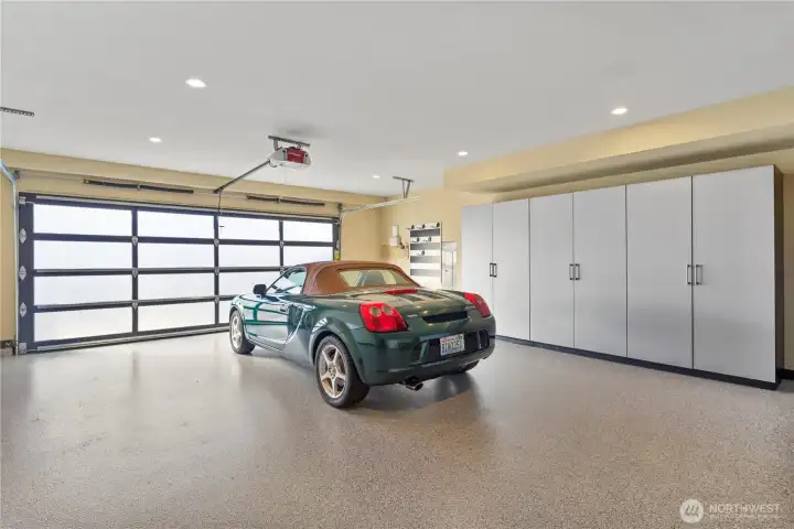 2-car garage with custom built-ins and new epoxy floor.