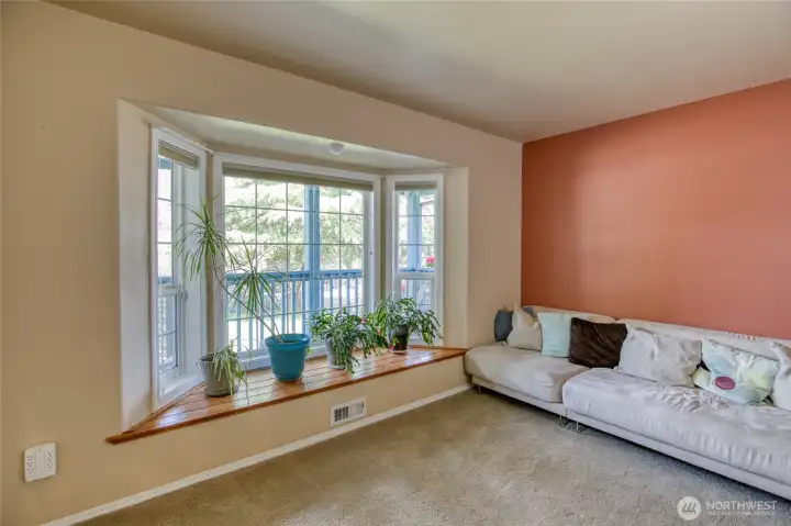Downstairs office space natural light window seat