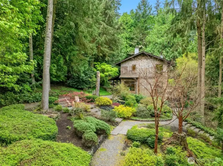 Groomed trails meander gracefully throughout the property, inviting peaceful walks and a true connection to the surrounding landscape.