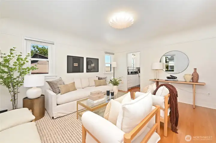 Light & bright living room features original fir hardwoods. Light & bright living room features original fir hardwoods.