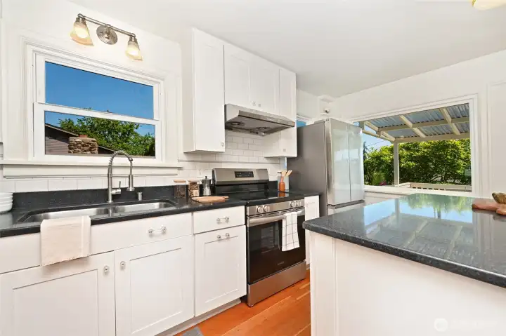 Kitchen features include refrigerator, microwave, dishwasher, range/oven, and beautiful granite countertops. Kitchen features include refrigerator, microwave, dishwasher, range/oven, and beautiful granite countertops.