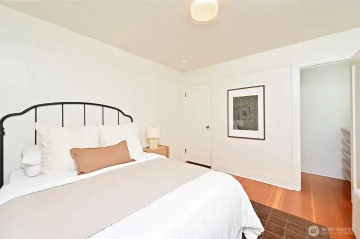 Main floor bedroom with walk-in closet. Main floor bedroom with walk-in closet.