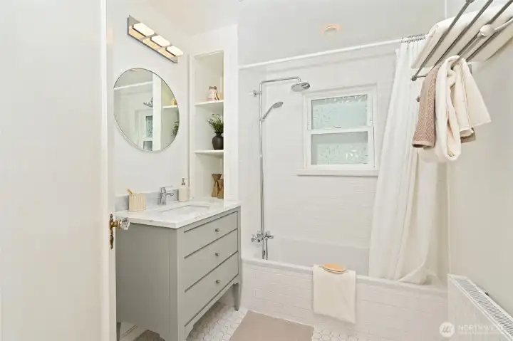 Main floor full bathroom with upgraded fixtures. Main floor full bathroom with upgraded fixtures.