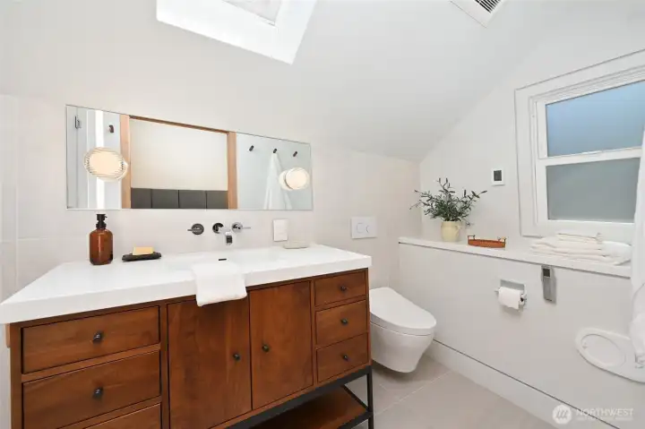 Wall mount toilet, and vacuum suction laundry chute are some of this homes' unique features. Wall mount toilet, and vacuum suction laundry chute are some of this homes' unique features.