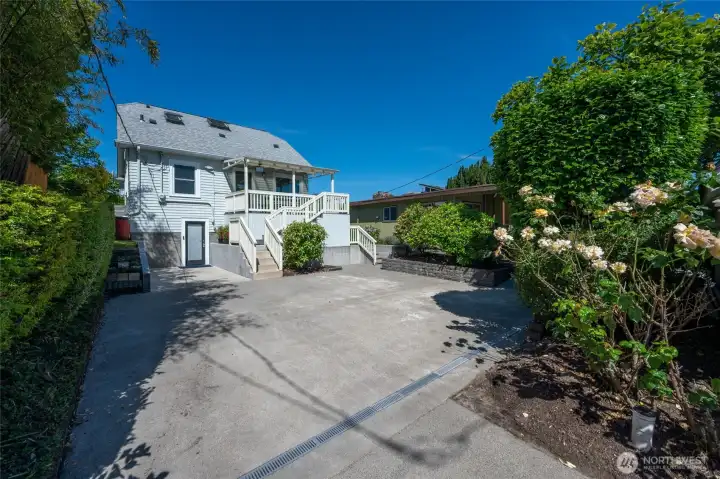 Large patio area for parking or play with access off the alley. Large patio area for parking or play with access off the alley.