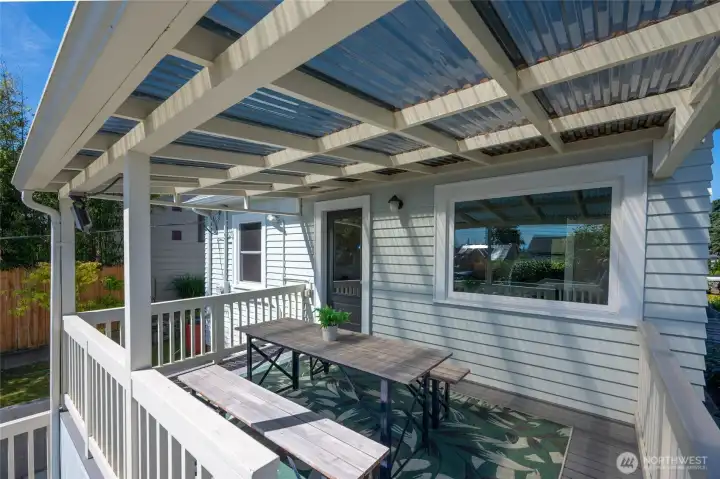 Enjoy the sunny backyard from this private covered deck. Enjoy the sunny backyard from this private covered deck.