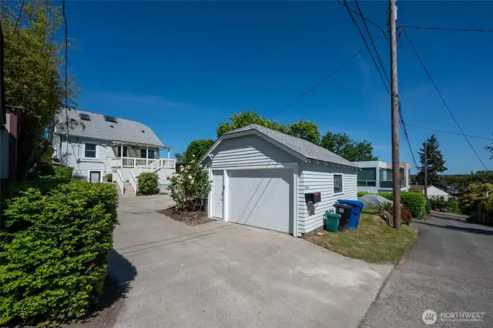 Detached garage access from the alley has garage door opener and door, plus additional driveway parking. Detached garage access from the alley has garage door opener and door, plus additional driveway parking.