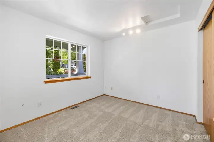 This room, located conveniently off the living area, offers versatile potential as a guest room, den, or home office. This room, located conveniently off the living area, offers versatile potential as a guest room, den, or home office.
