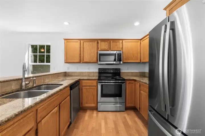New SS refrigerator and microwave, granite counter tops. New SS refrigerator and microwave, granite counter tops.