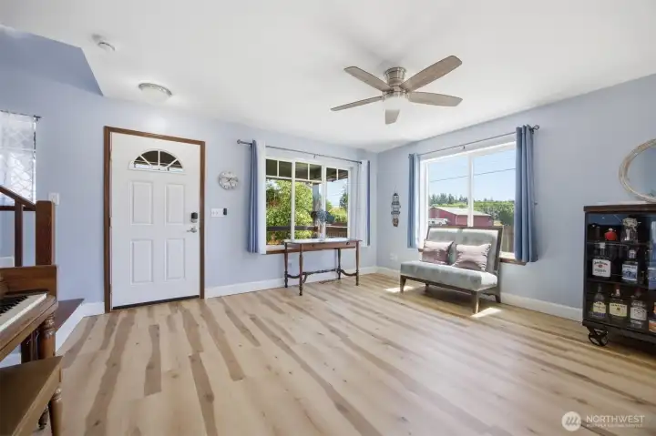 A grand sized living room with large picture windows A grand sized living room with large picture windows