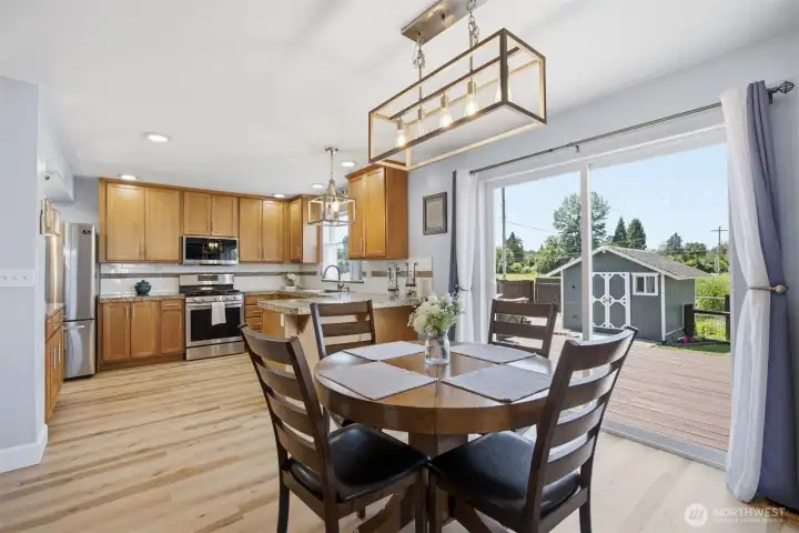 A dining room with sliding doors onto the back deck A dining room with sliding doors onto the back deck