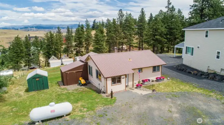 Lots of off street parking and two storage areas with room for additional outbuildings.