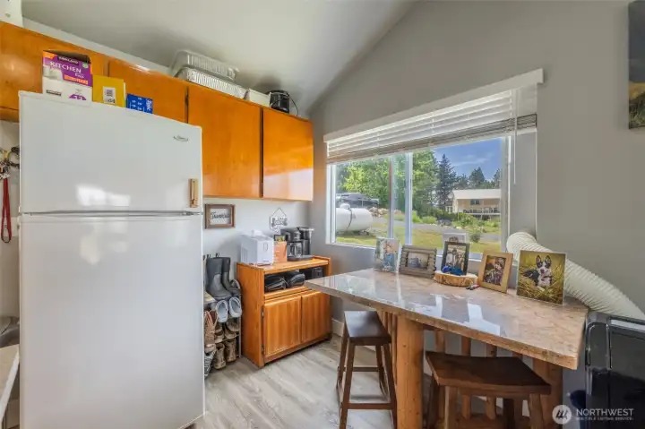 Vaulted ceilings in the open concept kitchen, dining, and living room area.