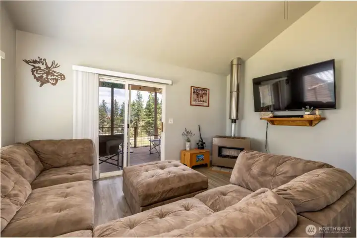 Newer vinyl plank flooring throughout the living room/kitchen area.