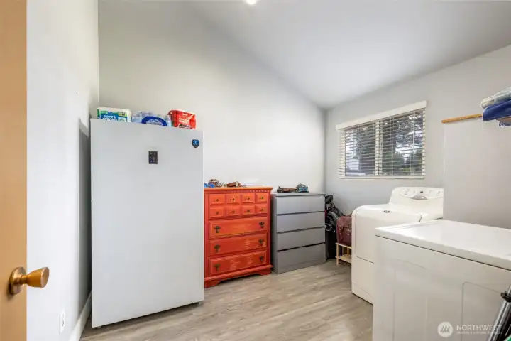 Bonus room features washer dryer hookups. Tenants use it as a utility room with freezer and storage. It could be used as a bunk room, home office, or guest space.