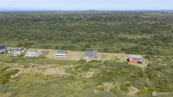 Aerial view looking East and the rear of the home. Aerial view looking East and the rear of the home.