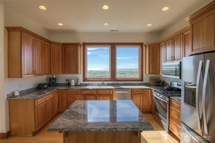 Lovely kitchen w/ Ocean views, Island, newer SS appliances, and a propane range. Lovely kitchen w/ Ocean views, Island, newer SS appliances, and a propane range.