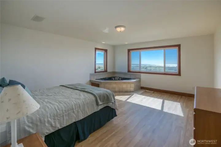 2nd-level Huge Master Bedroom w/ new LVP flooring, gorgeous Ocean Views, and a jetted tub. 2nd-level Huge Master Bedroom w/ new LVP flooring, gorgeous Ocean Views, and a jetted tub.