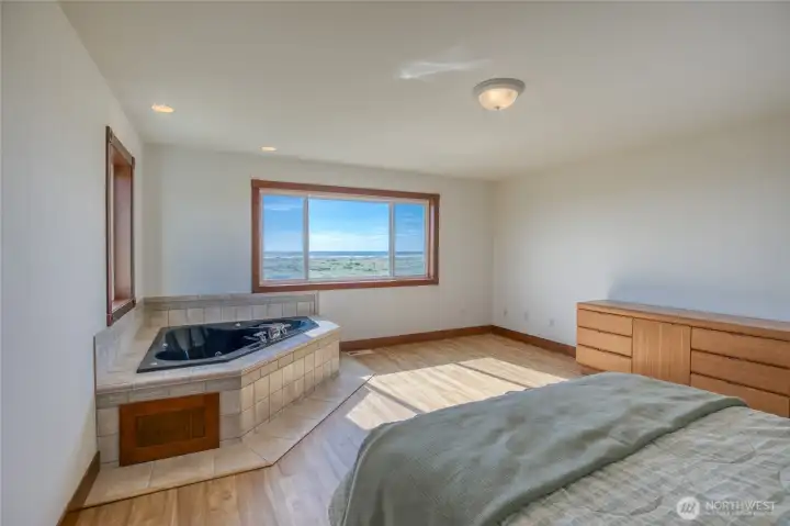 Spacious Master Bedroom w/ new LVP flooring, gorgeous Ocean Views, and a jetted tub. Spacious Master Bedroom w/ new LVP flooring, gorgeous Ocean Views, and a jetted tub.