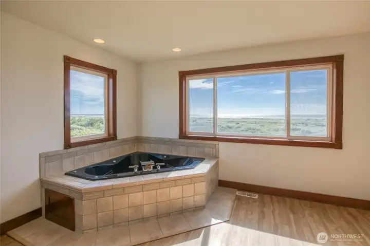 Enjoy soaking in the jetted tub overlooking the Ocean. Enjoy soaking in the jetted tub overlooking the Ocean.