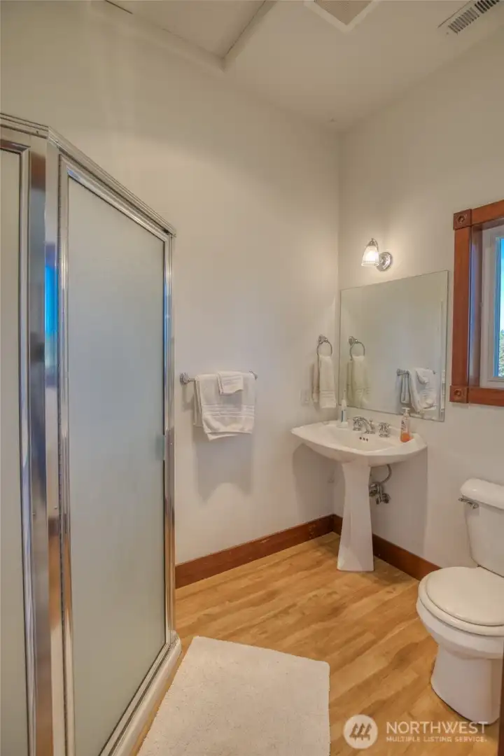 2nd-level 3/4-bathroom w/ new LVP flooring. 2nd-level 3/4-bathroom w/ new LVP flooring.