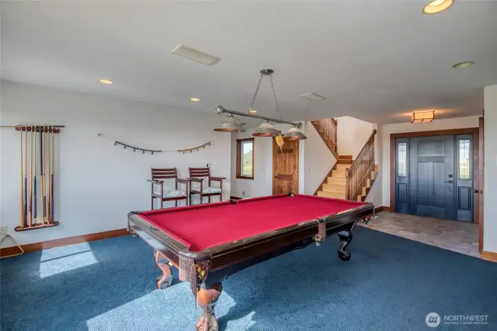 Entry the home from the Covered Front Deck into this large Rec/Game Room w/ pool table and arcade games included. Entry the home from the Covered Front Deck into this large Rec/Game Room w/ pool table and arcade games included.