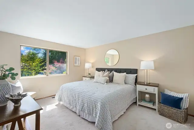 Your primary suite is spacious enough for a King bed and large side tables.