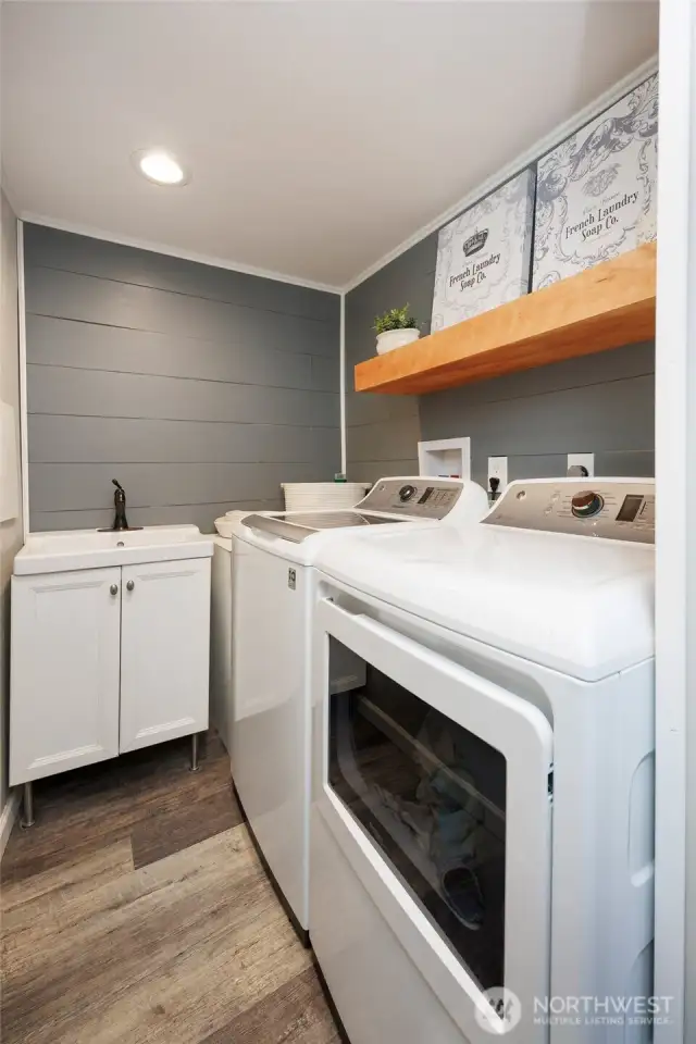 Remodeled lower level laundry room. All appliances stay.