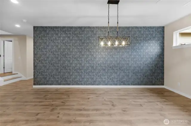 Beautiful dining accent wall and perfect lighting to go with it!