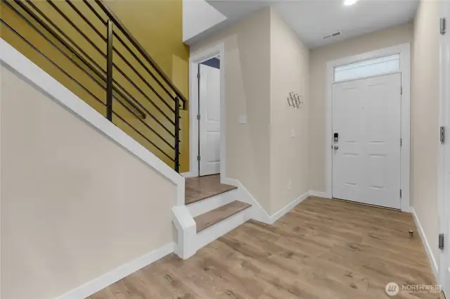 Grand entrance with accent wall going upstairs!