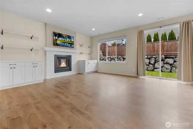 Plenty of natural sunlight you will get in this living space with all of the windows and sliding door.