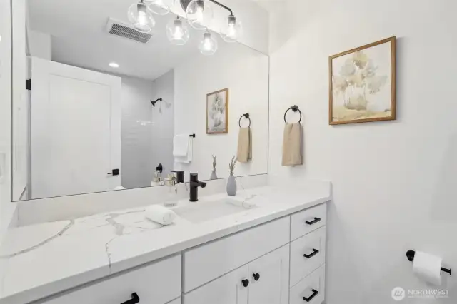 Photos of staged unit, 20313A. Level 3 common bath