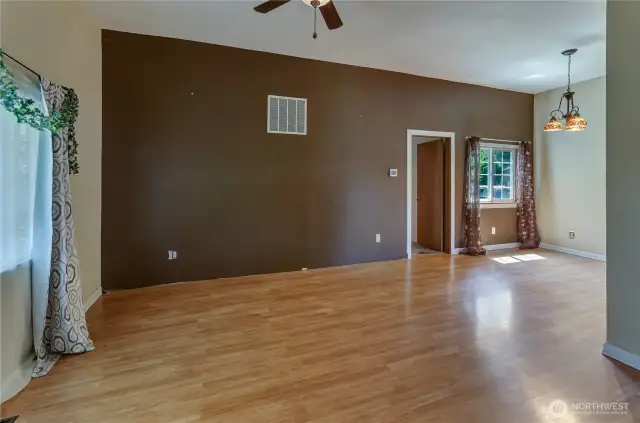Spacious open-concept living and dining area with great natural light ready for your personal touch and perfect for everyday living or entertaining.
